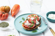 © ADDICTIVE STOCK - Caprese toast served on wooden table