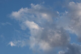 Fototapeta Niebo - White clouds against the blue sky.