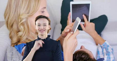 Wall Mural - animation of caucasian businesswoman over caucasian couple using tablet and smartphone
