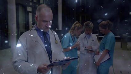 Wall Mural - Animation of spots over caucasian doctors talking