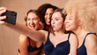 © Monkey Business - Group Of Diverse Body Positive Women Friends In Underwear Posing For Selfie On Mobile Phone