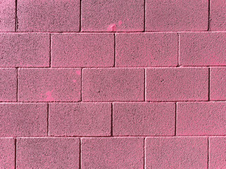 Wall Mural - pink solid block brick wall closeup cement cinder blocks exterior building