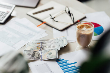 Working desk with tax form, laptop, coffee glass and calculator. Business financial and accounting concept.