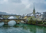 Fototapeta Paryż - Bridges and swiss buildings on Aare in Bern, Switzerland