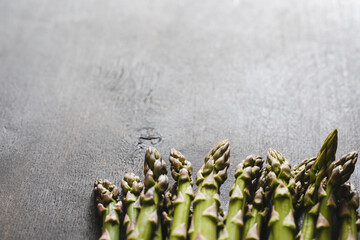 Wall Mural - Fresh Asparagus. Green fresh raw asparagus on rustic wooden table