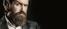 Portrait Of Handsome Bearded Man In Suit. Male Beard And Mustache. Sexy Male, Brutal Macho, Hipster. Elegant Handsome Man In Suit. Handsome Bearded Businessman