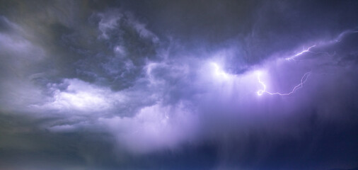 Wall Mural - Lightning and clouds in the night storm