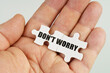 © Dzmitry - In the hand of a man are puzzles with the inscription - DO NOT WORRY