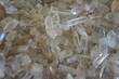 Raw crystal white quartz gemstone rocks. It has a hardness of 7 on the Mohs scale of mineral hardness.