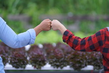 Couple Holding Hands Together. Handshake Between Two Businessmen. Close Up Of Two Hands Shaking Hands