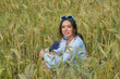 © fisher05 - Portrait of a young girl in light clothes sitting in a wheat field