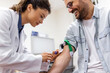 © Graphicroyalty - Preparation for blood test by female doctor medical uniform on the table in white bright room. Nurse pierces the patient's arm vein with needle blank tube.