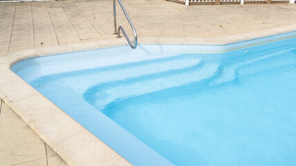 detail stairs liner top view of swimming pool with blue water