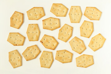 Wall Mural - Cracker cookies on a light background. Salted crackers with onions.