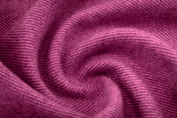 A piece of burgundy, violet, red cloth. Fabric texture for background and design works of art, beautiful wrinkled pattern of silk or linen. A crumpled piece of cloth