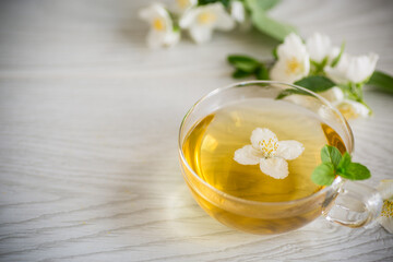 Poster - Composition with cup of jasmine tea and flowers