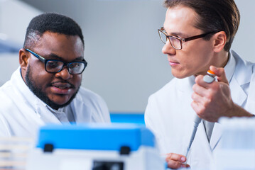 Wall Mural - Professional Doctors Doing Monkeypox Research in a Modern Futuristic Laboratory. Lab Experiments in Clinic Hospital. Science and Medicine Concept.