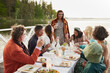© Johnér - Family having dinner by lake
