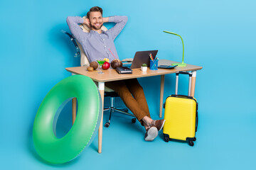 Wall Mural - Full body photo of good mood travel agency worker have a break from work isolated on blue color background