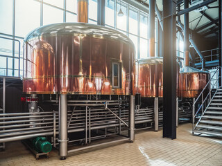 Wall Mural - Beer tanks with many steel pipes in craft brewery.