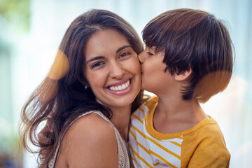 Poster - Proud mom to the worlds best son. Shot of an adorable little boy affectionately kissing his mother at home.