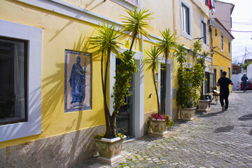 Beautiful old narrow street of Old Town in Lisbon, Portugal