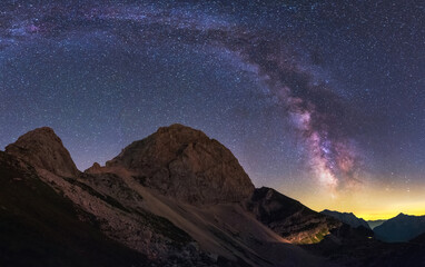 Milky Way above Vrsic mountain pass in Julian Alps in Slovenia