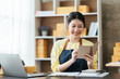 © PaeGAG - Starting small businesses SME owners female entrepreneurs check online orders to prepare to pack the boxes, sell to customers, sme business ideas online.