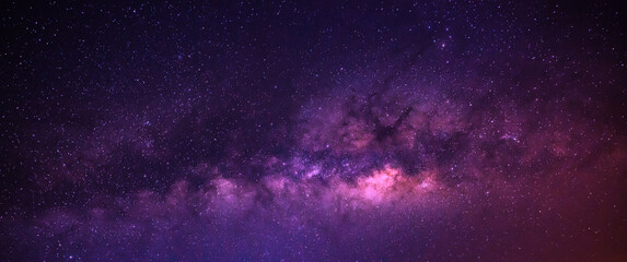 milky way in the night sky and stars on dark background with noise and grain. photo taken with long 