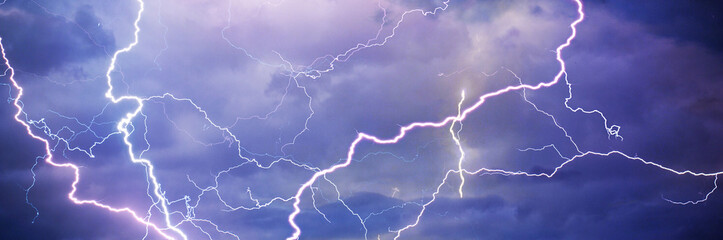 fork lightning striking down during summer storm