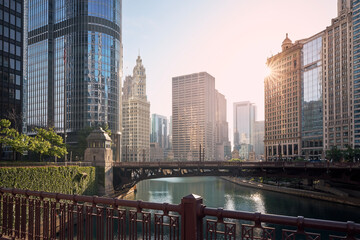 Wall Mural - Bridges over Chicago River amidst skyscrapers. Urban skyline at beautiful sunrise. .