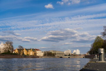 Buildings near river and sky at background in Wroclaw