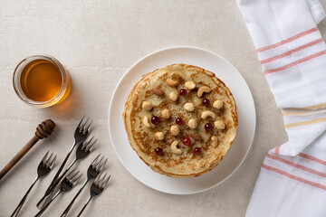 Wall Mural - Big pancakes on the table, cooking delicious homemade pancakes