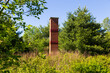 © Anne Richard - Brick chimney installed in the Cherry River marsh to help the chimney swift nesting behaviour, Magog, Quebec, Canada