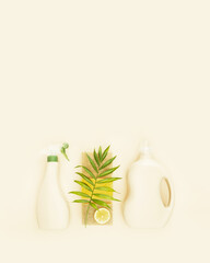 Canvas Print - Vertical banner with natural, cleaning products. Eco friendly, home cleaning composition with a bottles of natural detergent for the home, sponges, slice of lemon and palm leaf on ivory background