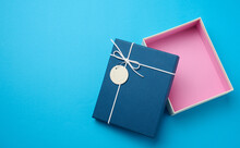 Empty Open Rectangular Gift Cardboard Box On Blue Background, Top View