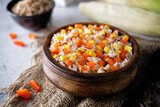 Fototapeta Kawa jest smaczna - Corn red bell pepper black and white and brown rice in a bowl