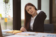 © itchaznong - Image of Asian Business Woman relieve pain her neck suffering from sedentary work. office syndrome concept.