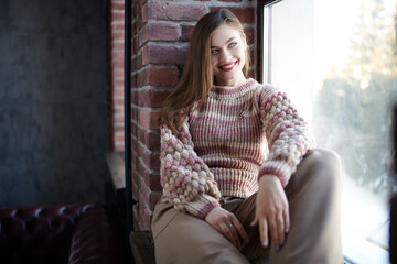 Wall Mural - girl on a windowsill