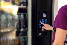 Hand Presses Button Of Vending Machine. Self-used Technology And Consumption Concept