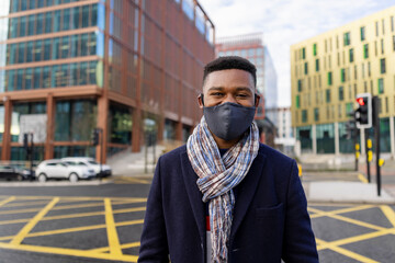 Wall Mural - Portrait of Man Wearing Face Mask in City Centre