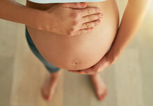 No Other Feeling Comes Close. Cropped High Angle Shot Of A Pregnant Woman Holding Her Bare Belly.