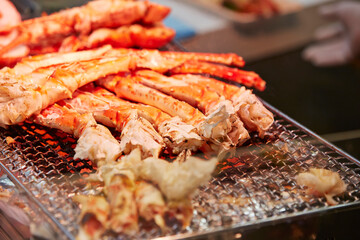 Canvas Print - Grilled king crab legs displayed in a traditional market