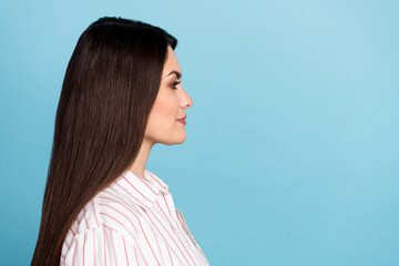 Wall Mural - Profile side view portrait of attractive content long-haired girl copy blank space isolated over blue pastel color background