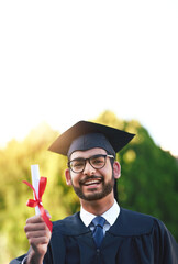 Poster - Finally, its in my hands. Portrait of a university student holding his diploma on graduation day.
