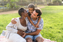 Happy Multiracial Family Having Fun Together In The Park