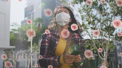 Canvas Print - Animation of flowers falling over biracial women wearing face mask