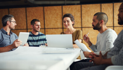 Sticker - Theyll come up with the best way forward. Shot of a group of coworkers having a meeting in an open plan office.