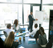 © Thurstan Hinrichsen/peopleimages.com - Keeping everyone informed of business developments. Shot of a businessman giving a presentation to his colleagues in an office.