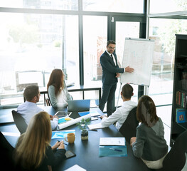 Aufkleber - Keeping everyone informed of business developments. Shot of a businessman giving a presentation to his colleagues in an office.